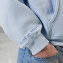 GLIMMER LOGO HOODIE POWDER BLUE